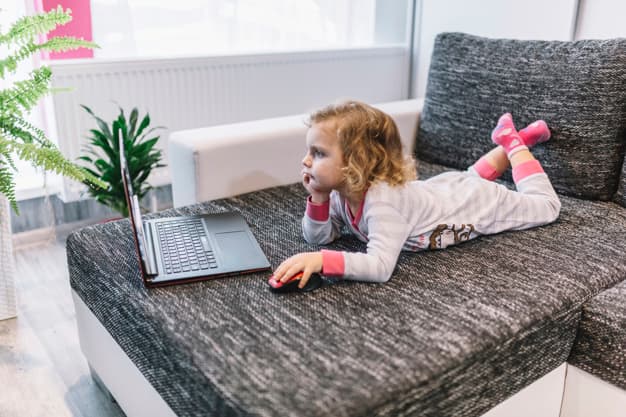 little-girl-using-laptop-couch_23-2147833855 (1)